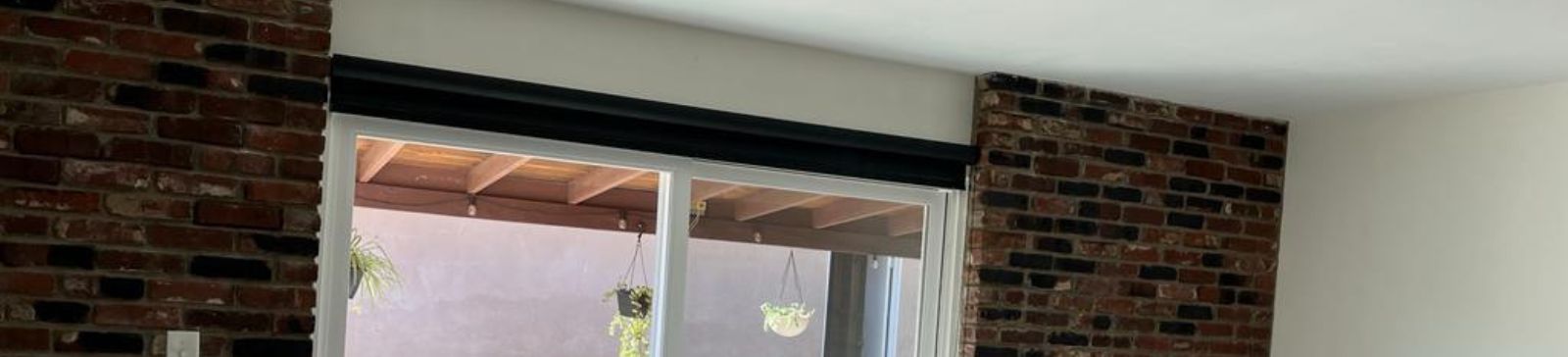 Close-up of roller shade on sliding glass door, showing smooth operation and stylish design